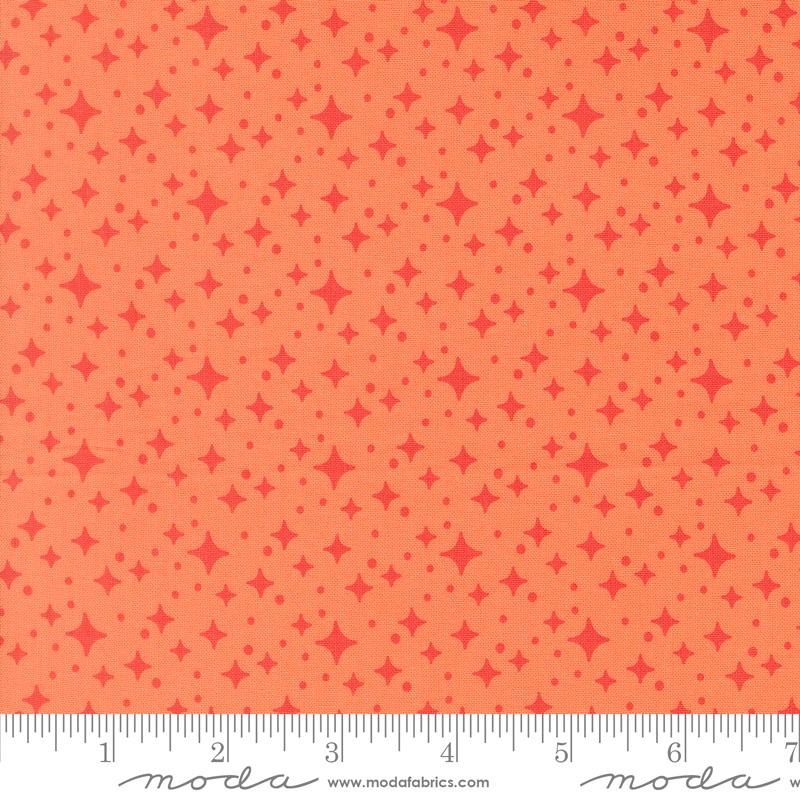 Popcorn Starburst Coral - Quilt Fabric, zoomed in. Select this picture to zoom back out.