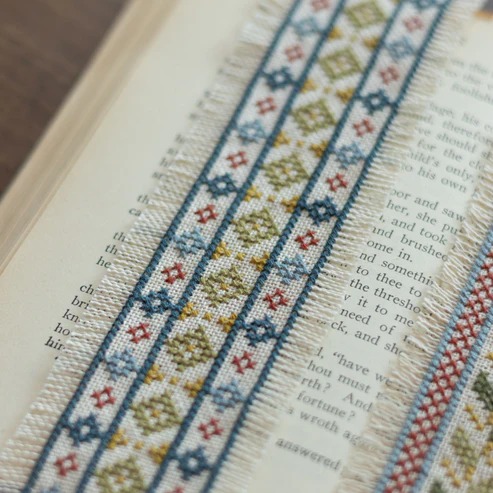 Folk Fabric Sampler Ivory - Cross Stitch Kit, different perspective #1, zoomed in. Select this picture to zoom back out.