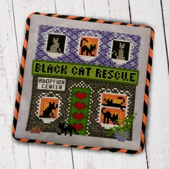 Black Cat Rescue - Halloween Cross Stitch Pattern, zoomed in. Select this picture to zoom back out.