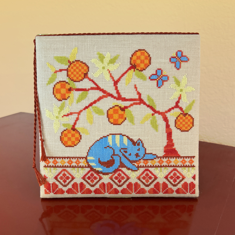 Under the Orange Tree - Cross Stitch Pattern, zoomed in. Select this picture to zoom back out.