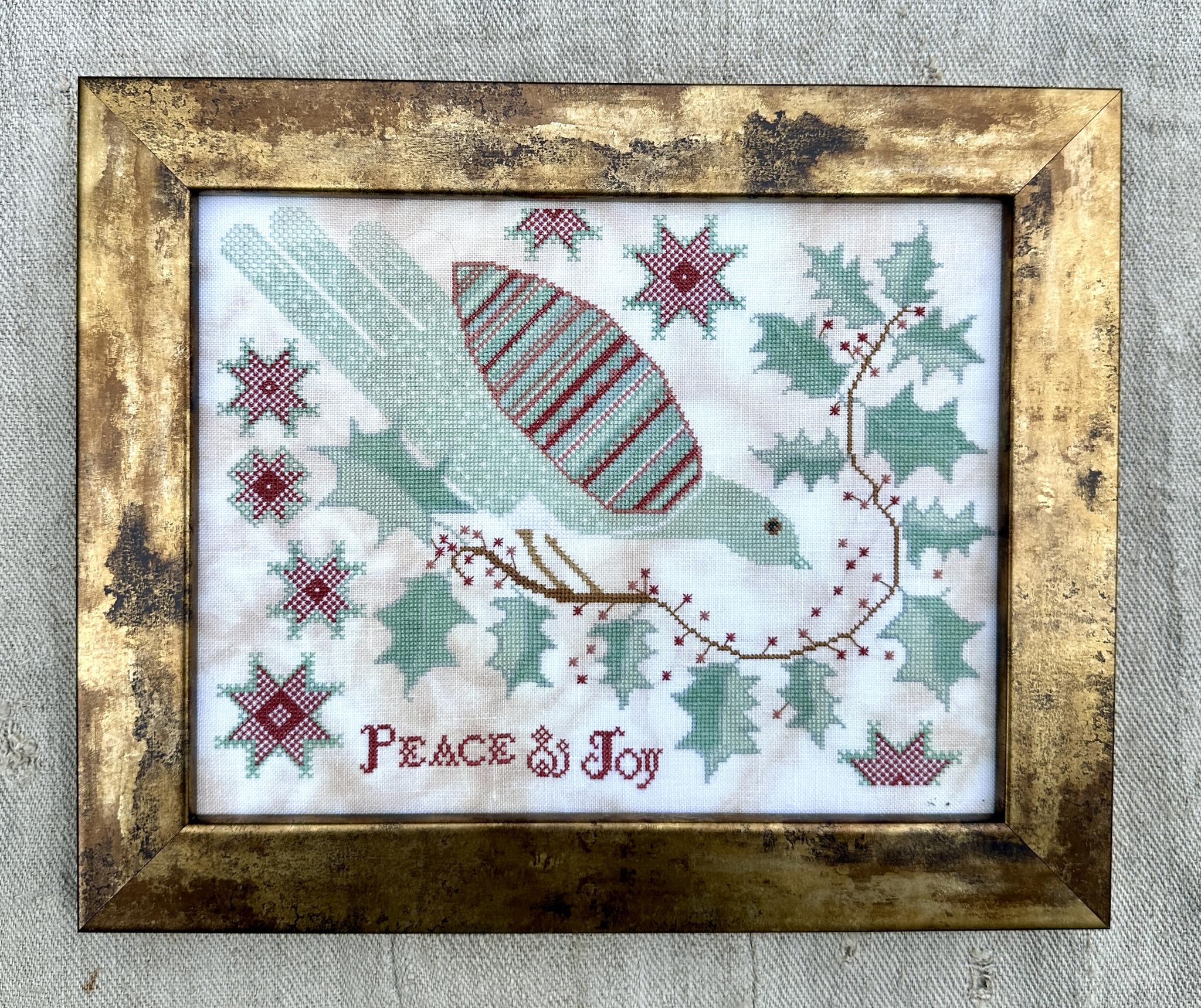 Peace and Joy - Christmas Cross Stitch Pattern, different perspective #1, zoomed in. Select this picture to zoom back out.