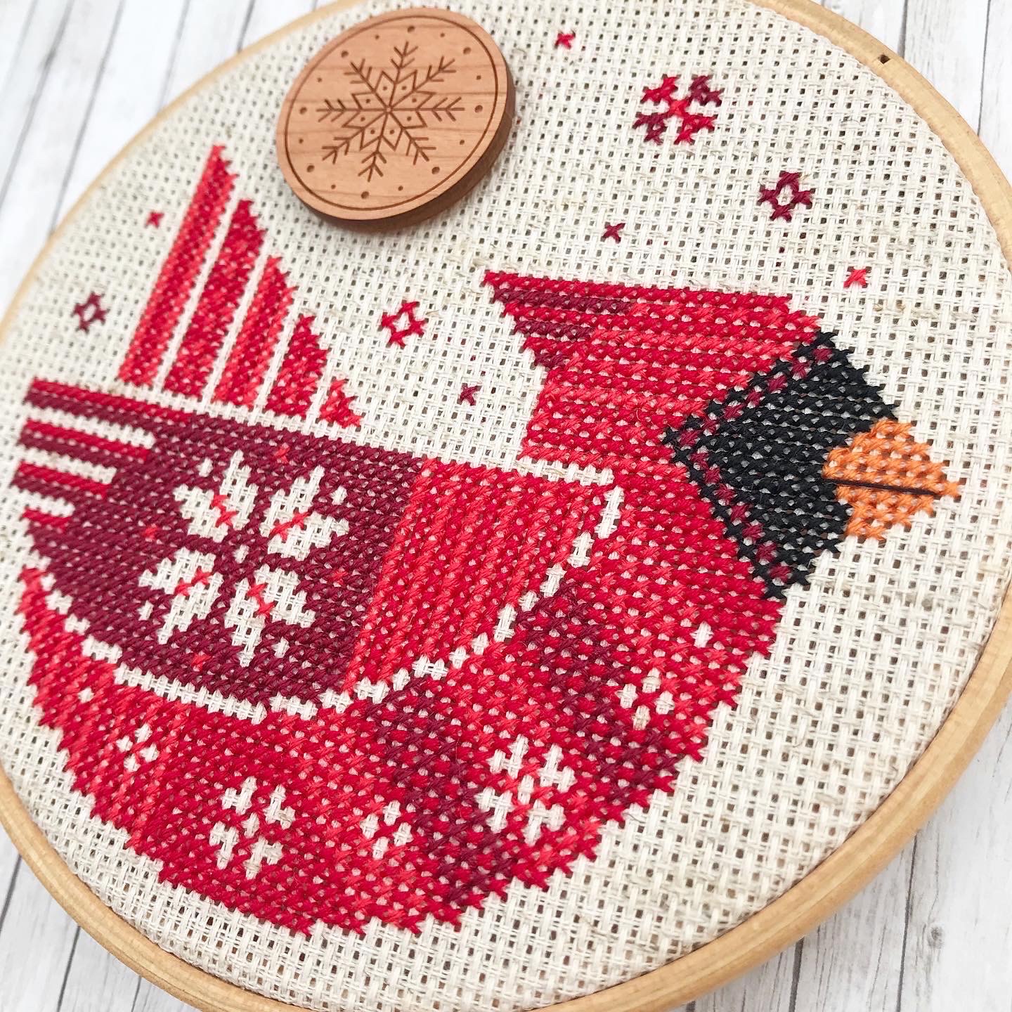 Festive Cardinal - Christmas Cross Stitch Pattern, different perspective #1, zoomed in. Select this picture to zoom back out.