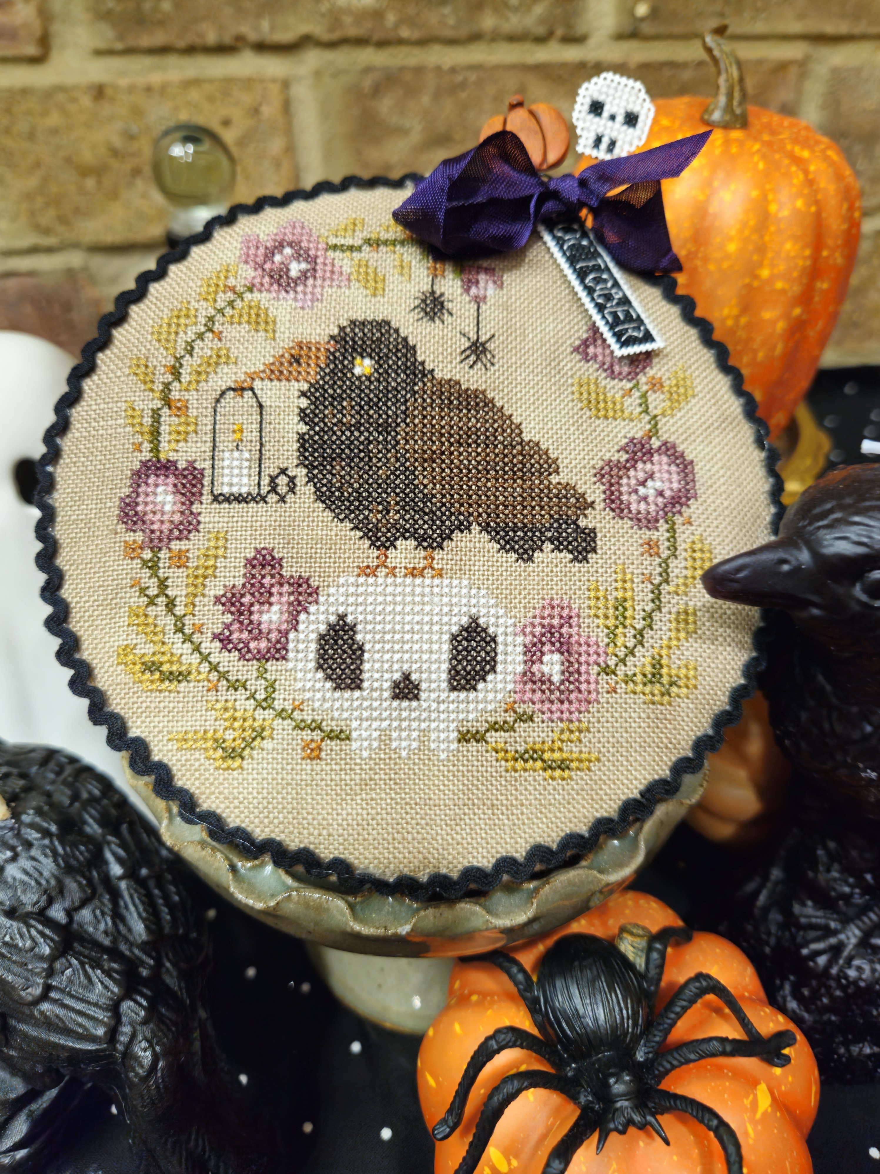 Pin Drum Shorties: Month #10 Crow - Halloween Cross Stitch, zoomed in. Select this picture to zoom back out.