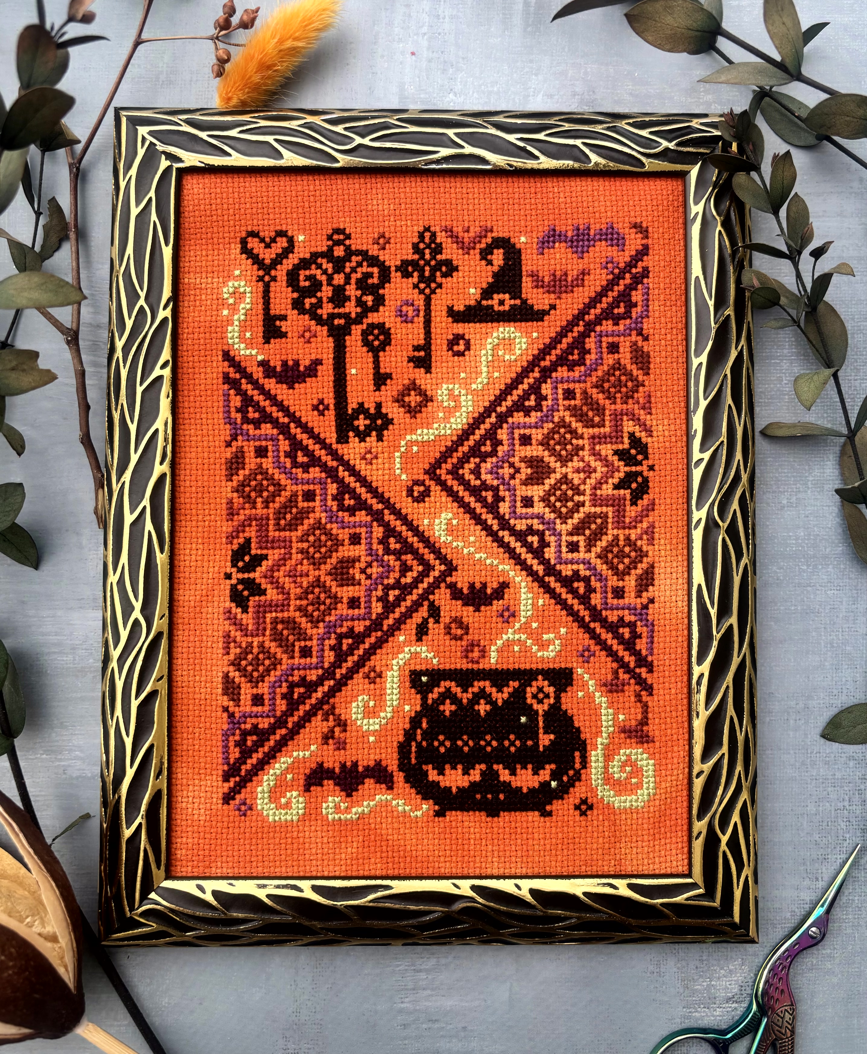 The Cauldron and the Key - Halloween Cross Stitch Pattern, zoomed in. Select this picture to zoom back out.