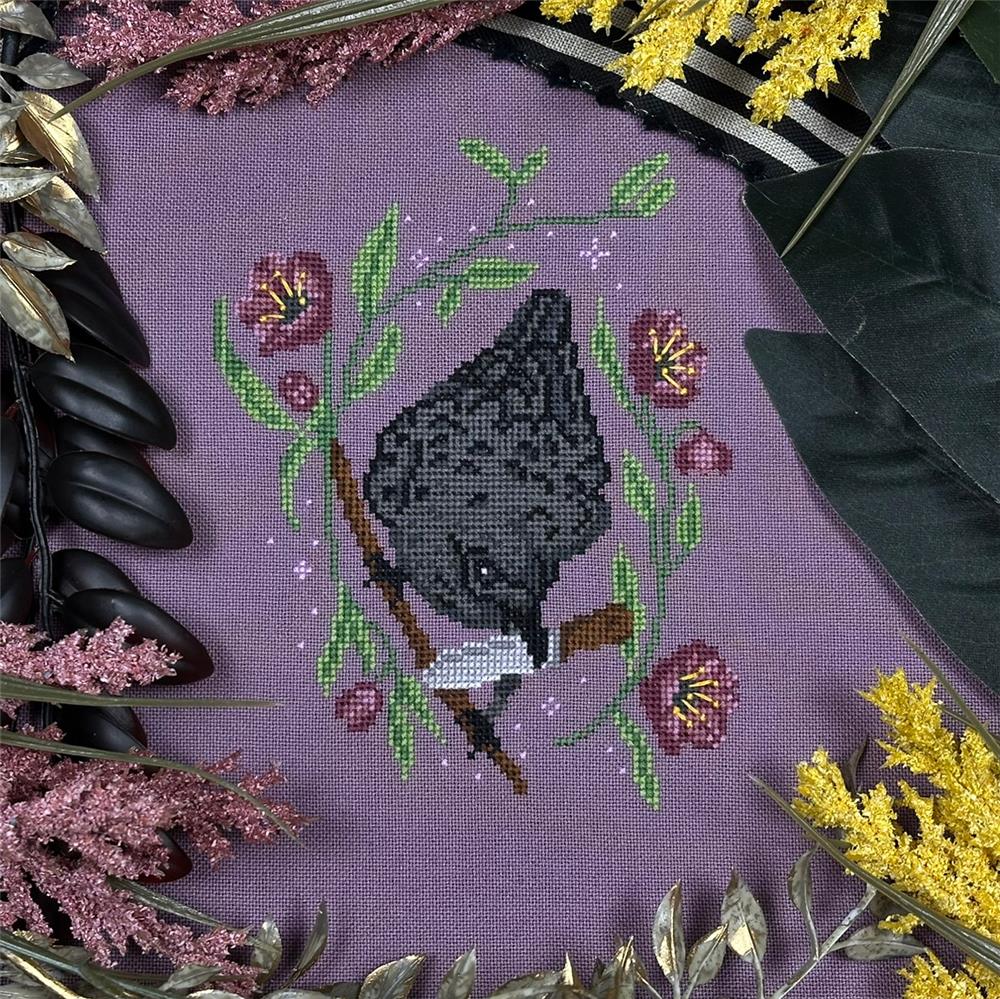 Hellebore and Crow - Halloween Cross Stitch Pattern, zoomed in. Select this picture to zoom back out.