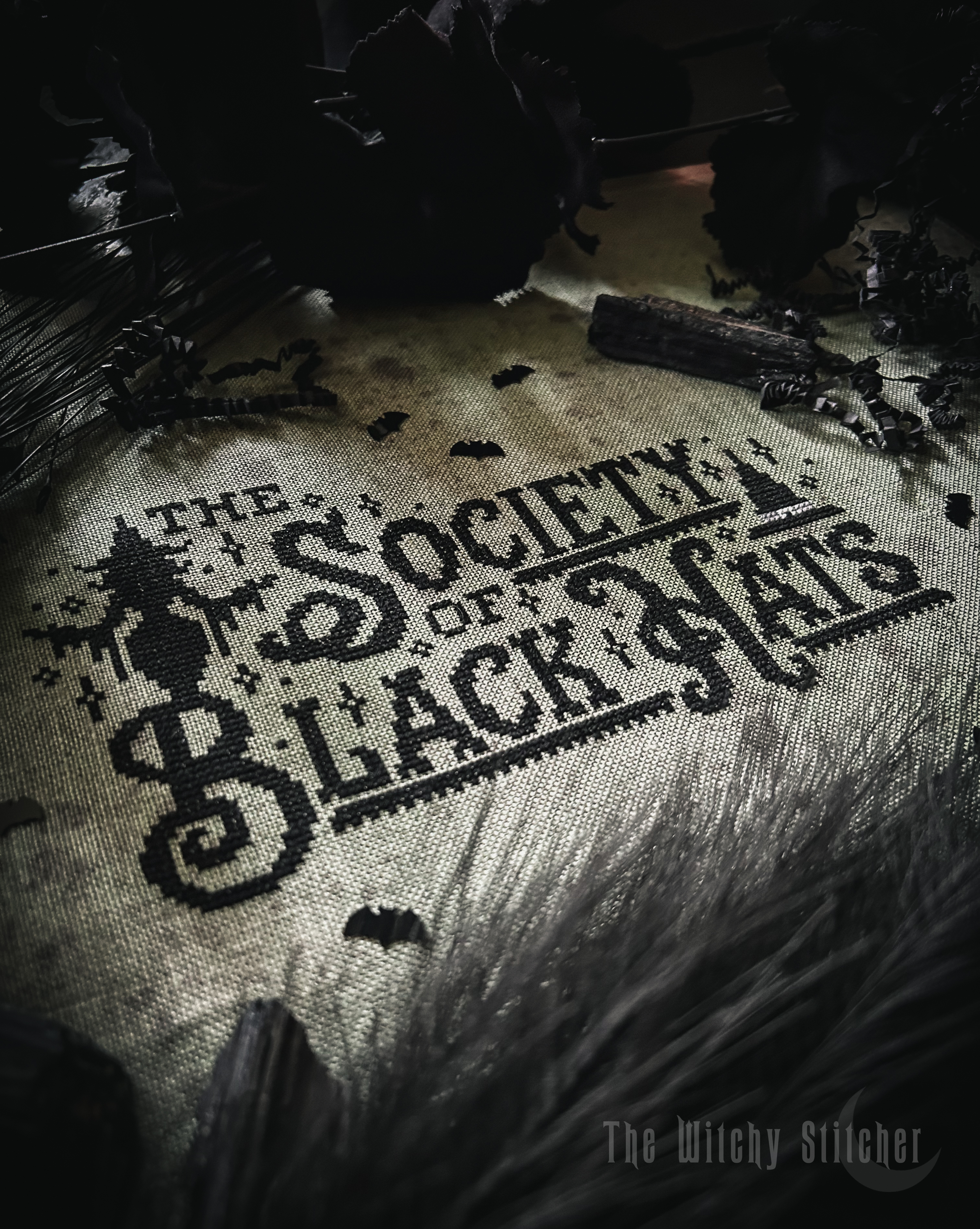 The Society Of Black Hats Halloween PDF Cross Stitch Pattern, different perspective #1, zoomed in. Select this picture to zoom back out.