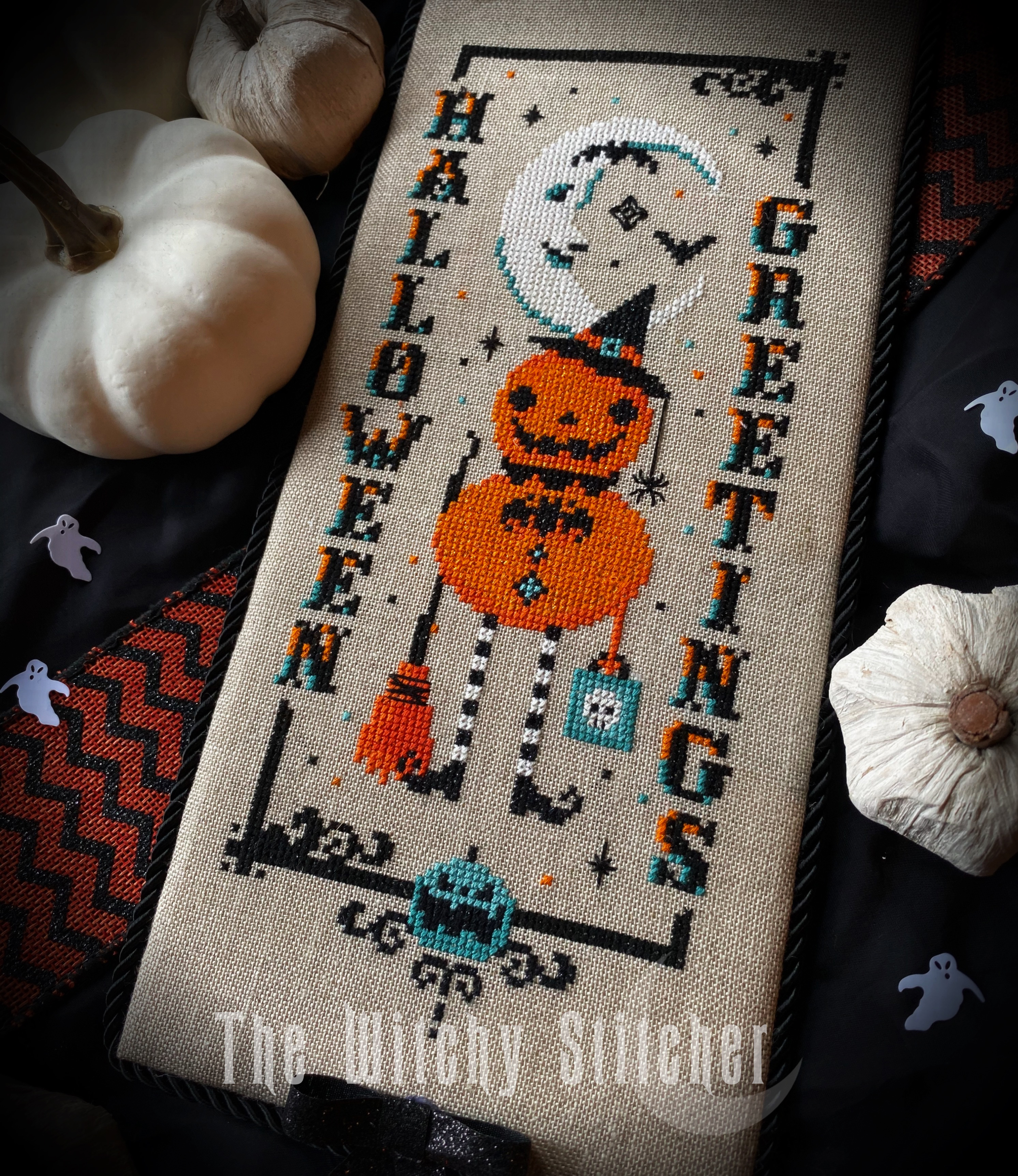 Vintage Pumpkin Witch - Halloween Cross Stitch Pattern, different perspective #1, zoomed in. Select this picture to zoom back out.